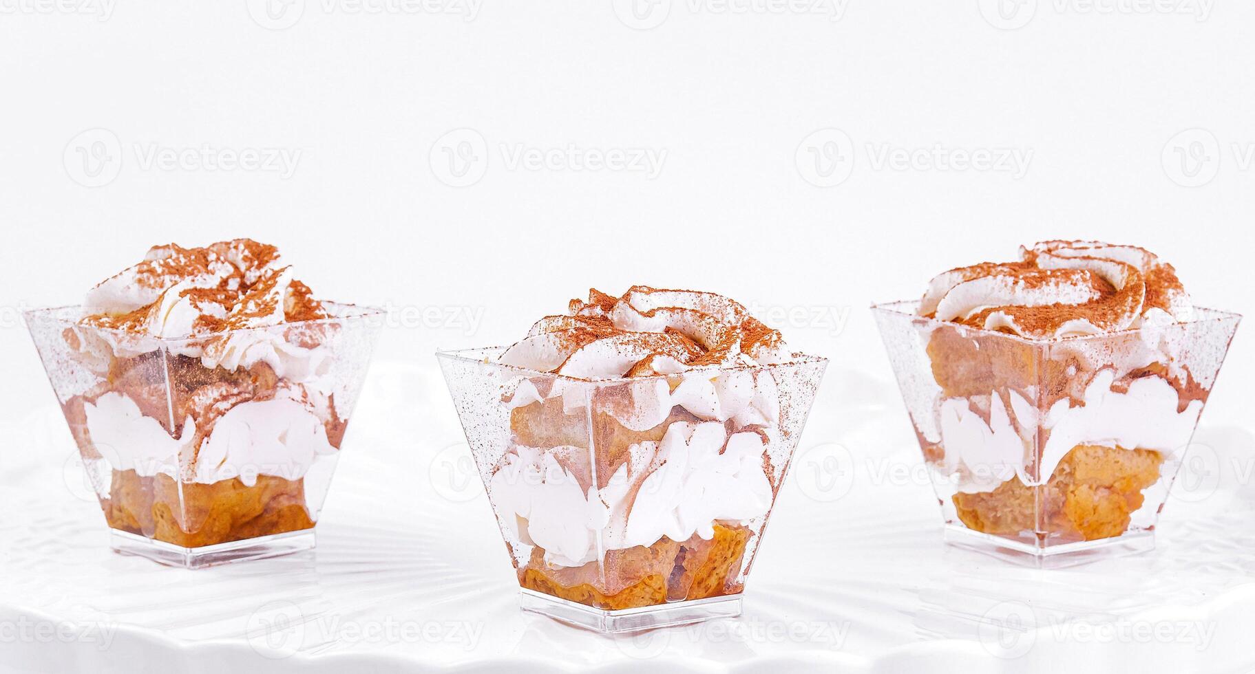 Elegant white cake stand with gourmet cupcakes photo