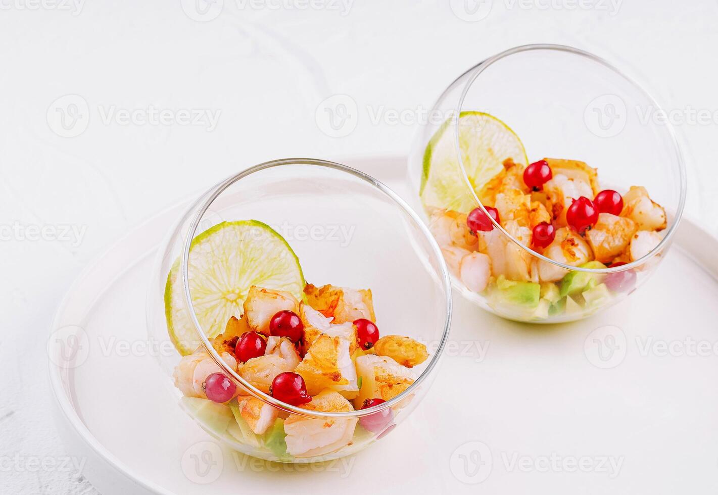 Fresh citrus shrimp ceviche in glass bowls photo