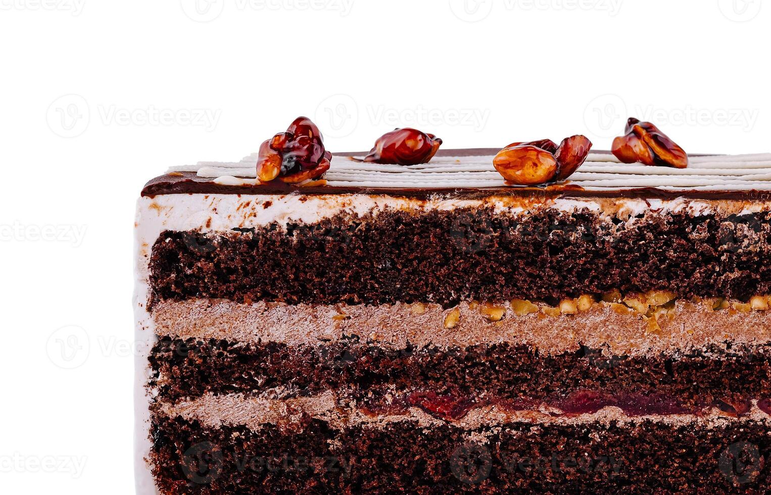 Delicious chocolate cake with nuts and cherry filling showing its layers photo