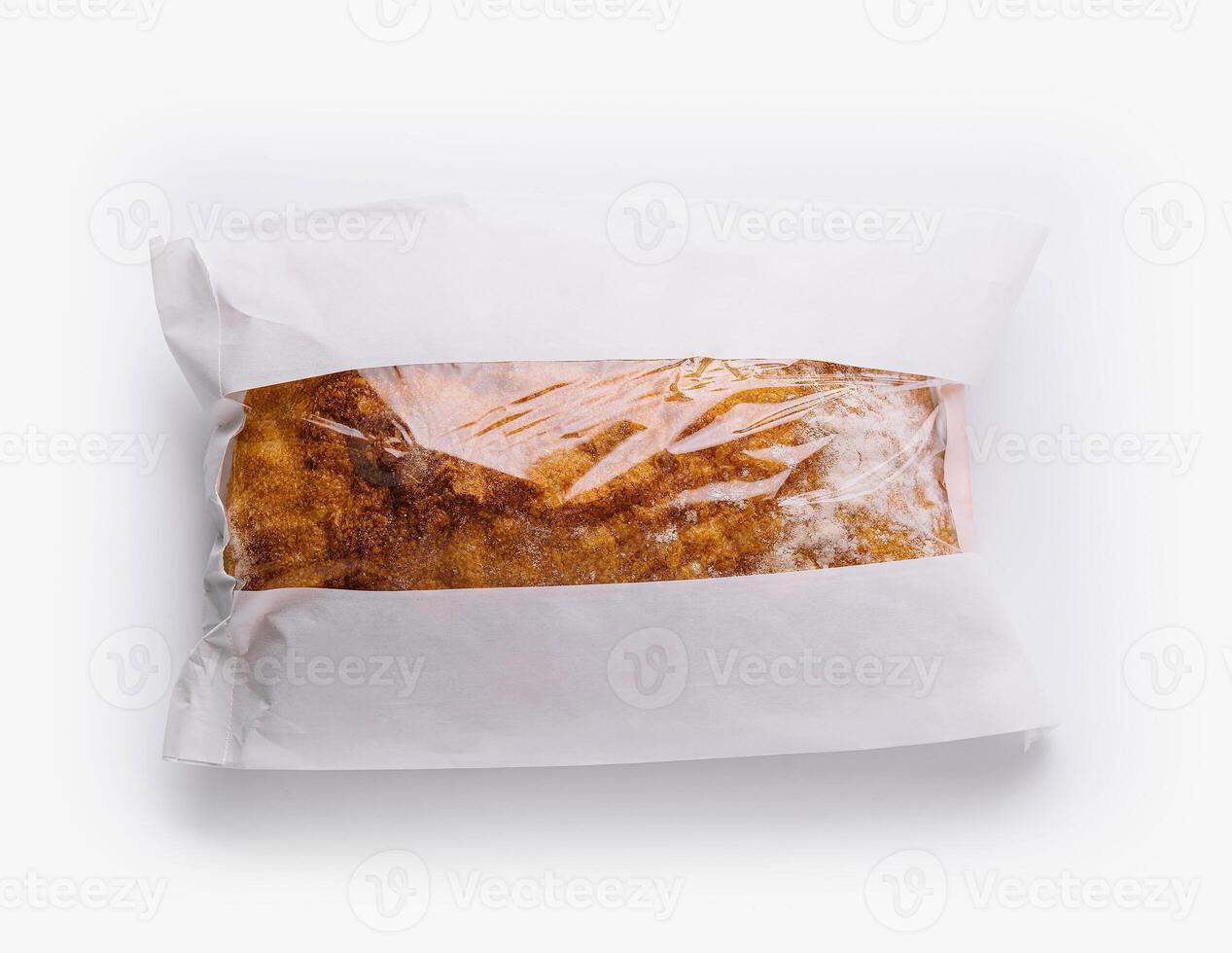 Sealed bread loaf in transparent packaging photo