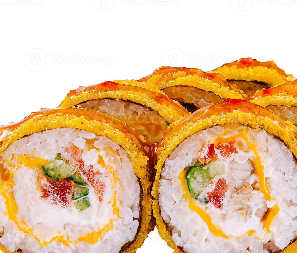 Tempura maki sushi rolls covered with nuts and sauce lying on white background photo