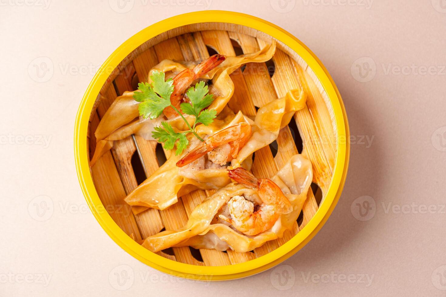 shrimp dumplings in bamboo steamer basket photo