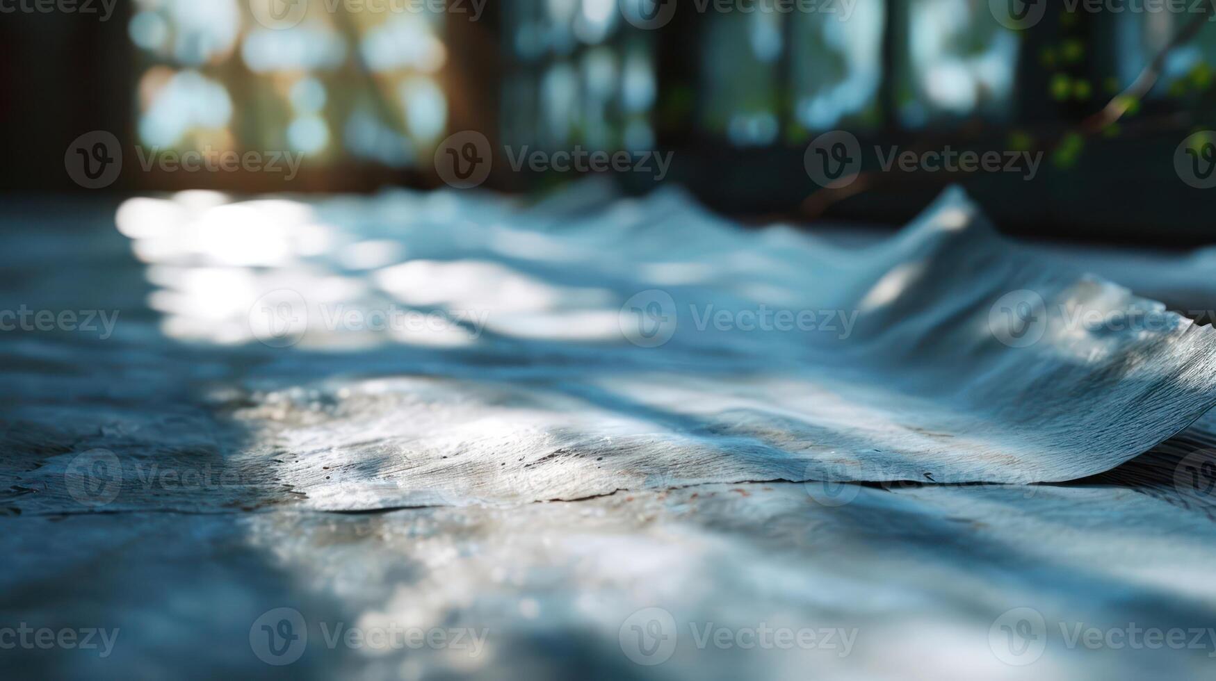 A newspaper laying on the floor next to a window photo