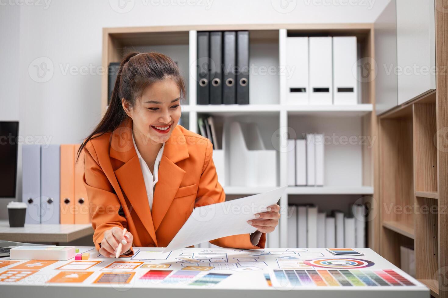 System Developers Analyzing UX UI Plans in Modern Office Environment for Optimal User Experience Design photo