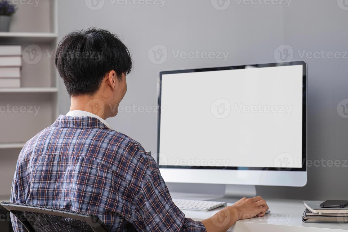 Young Boy Studying Online at Home Using Desktop Computer in Modern Study Room photo