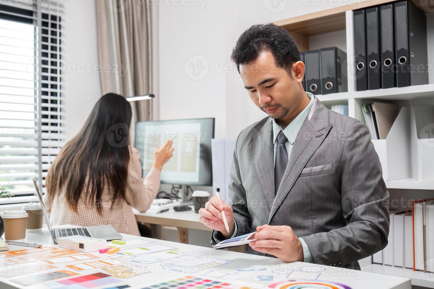 System Development Team Collaborating on UX UI Design in Modern Office Environment photo