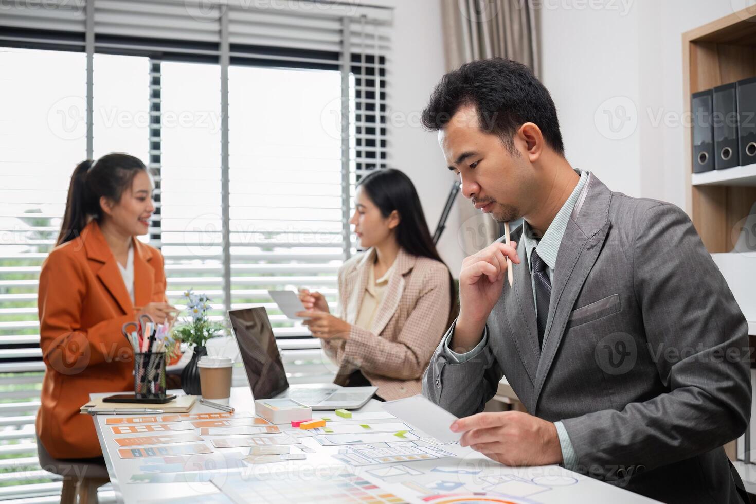 System Development Team Collaborating on UX UI Design in Modern Office Environment photo