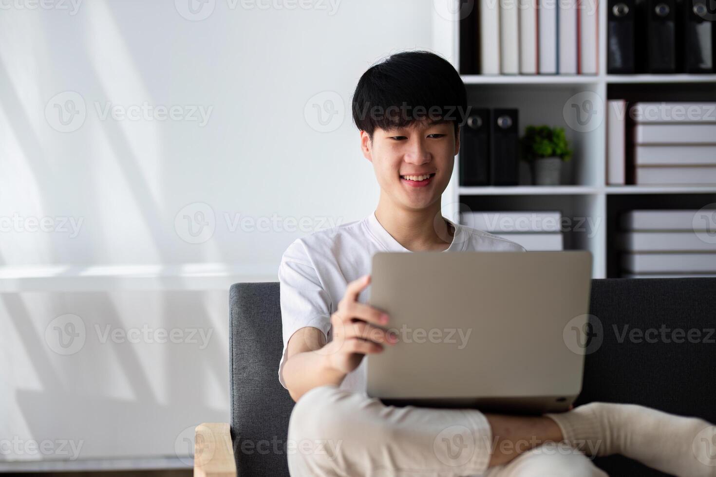 Young Boy Studying Online at Home with Laptop, Engaged in Virtual Learning, Remote Education, and Digital Classroom Activities photo