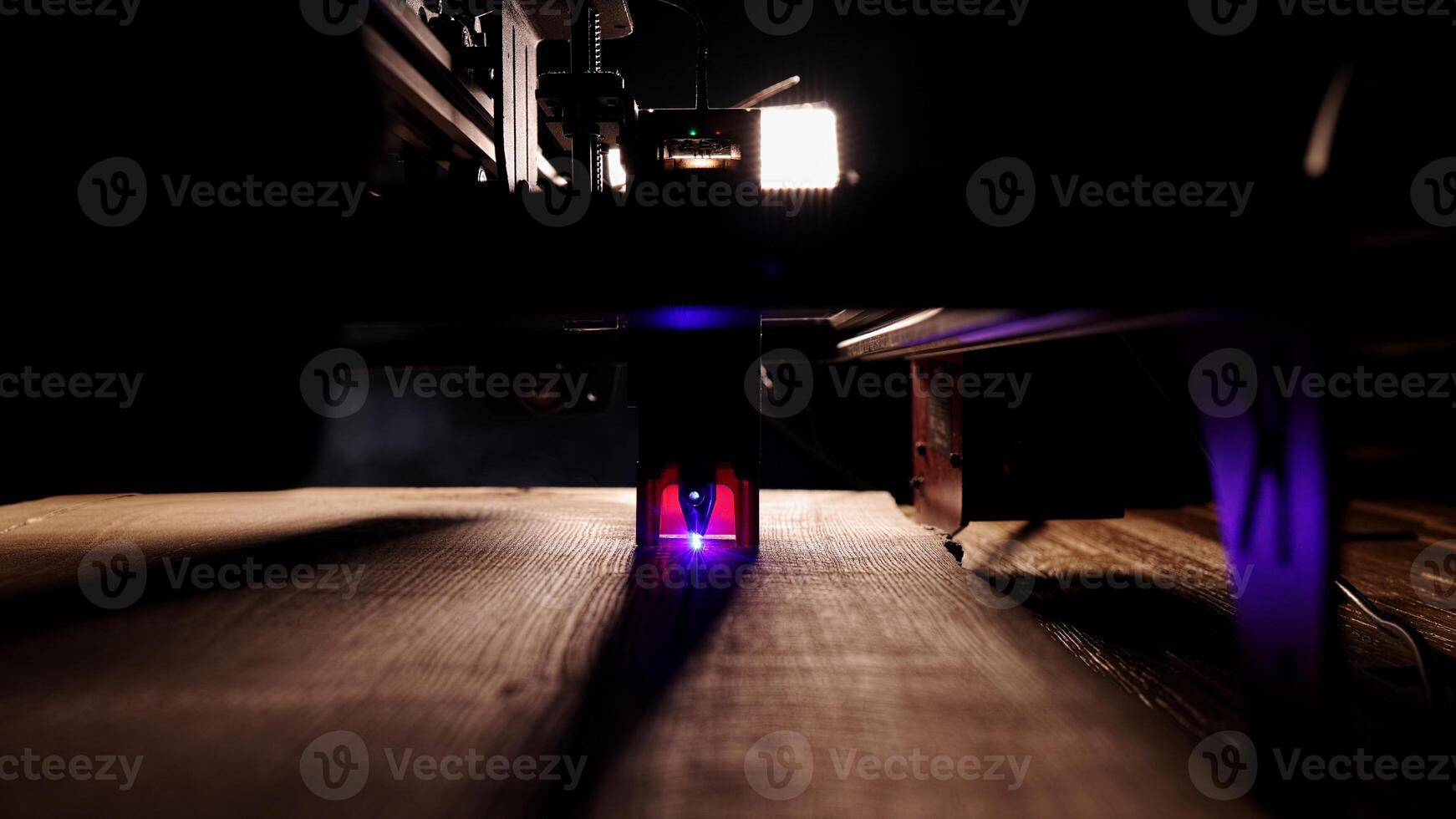 The process of laser wood cutting. A laser machine precisely carves lines on the surface, creating detailed and accurate designs. Perfect for themes of high-tech and manufacturing photo