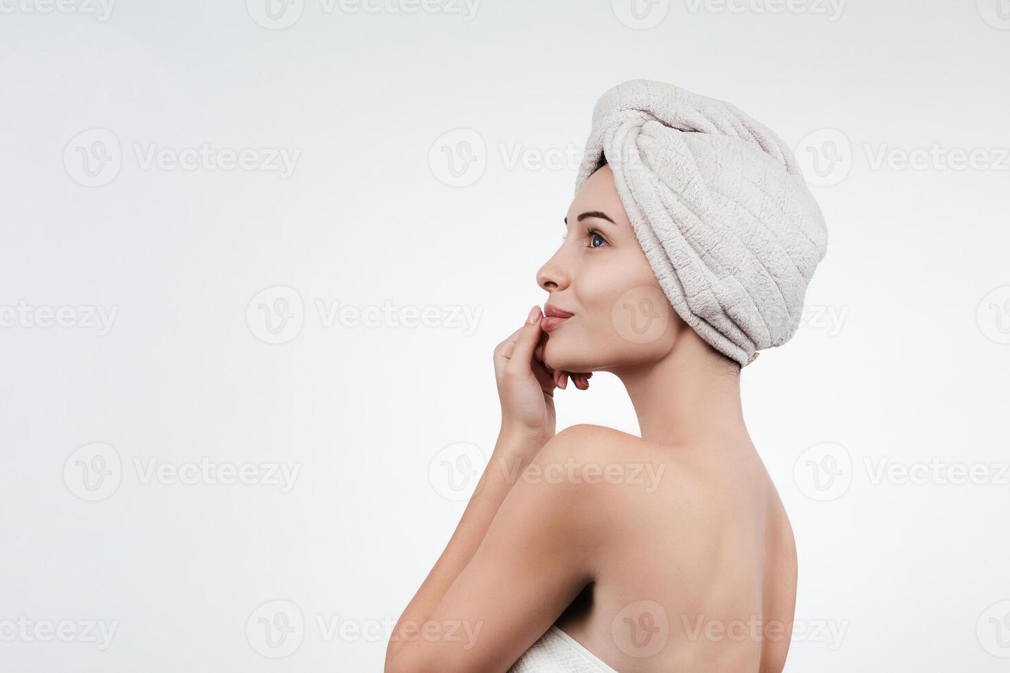 A portrait of a young woman with flawless, smooth skin against a white background. This image embodies allure and femininity, highlighting the concepts of natural beauty and skincare photo