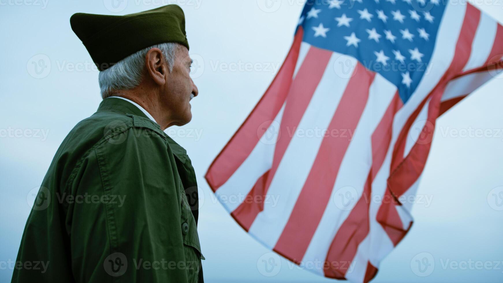 Veteran Soldier Admiring USA Flag photo
