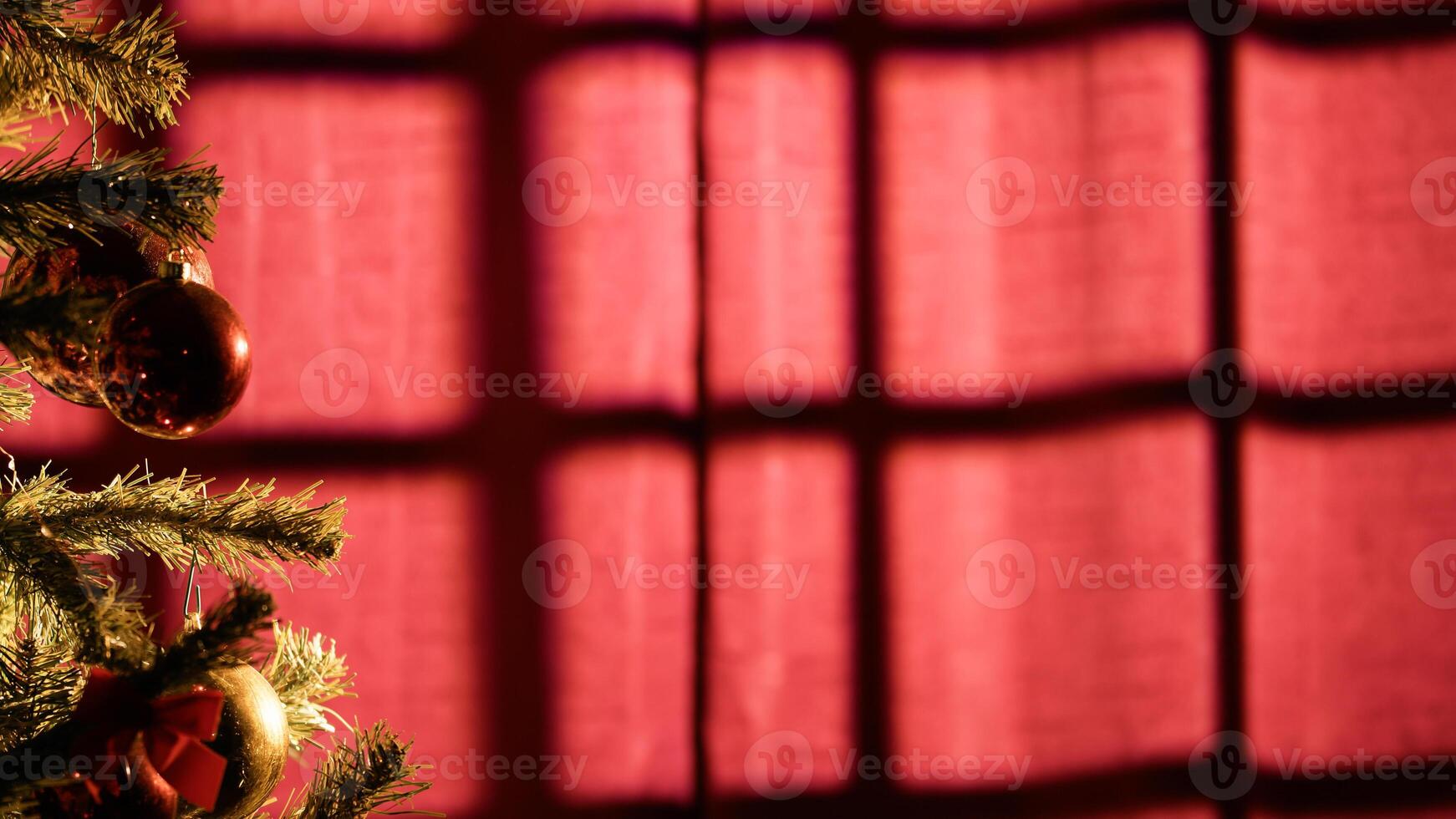 Christmas tree with light coming from the window photo