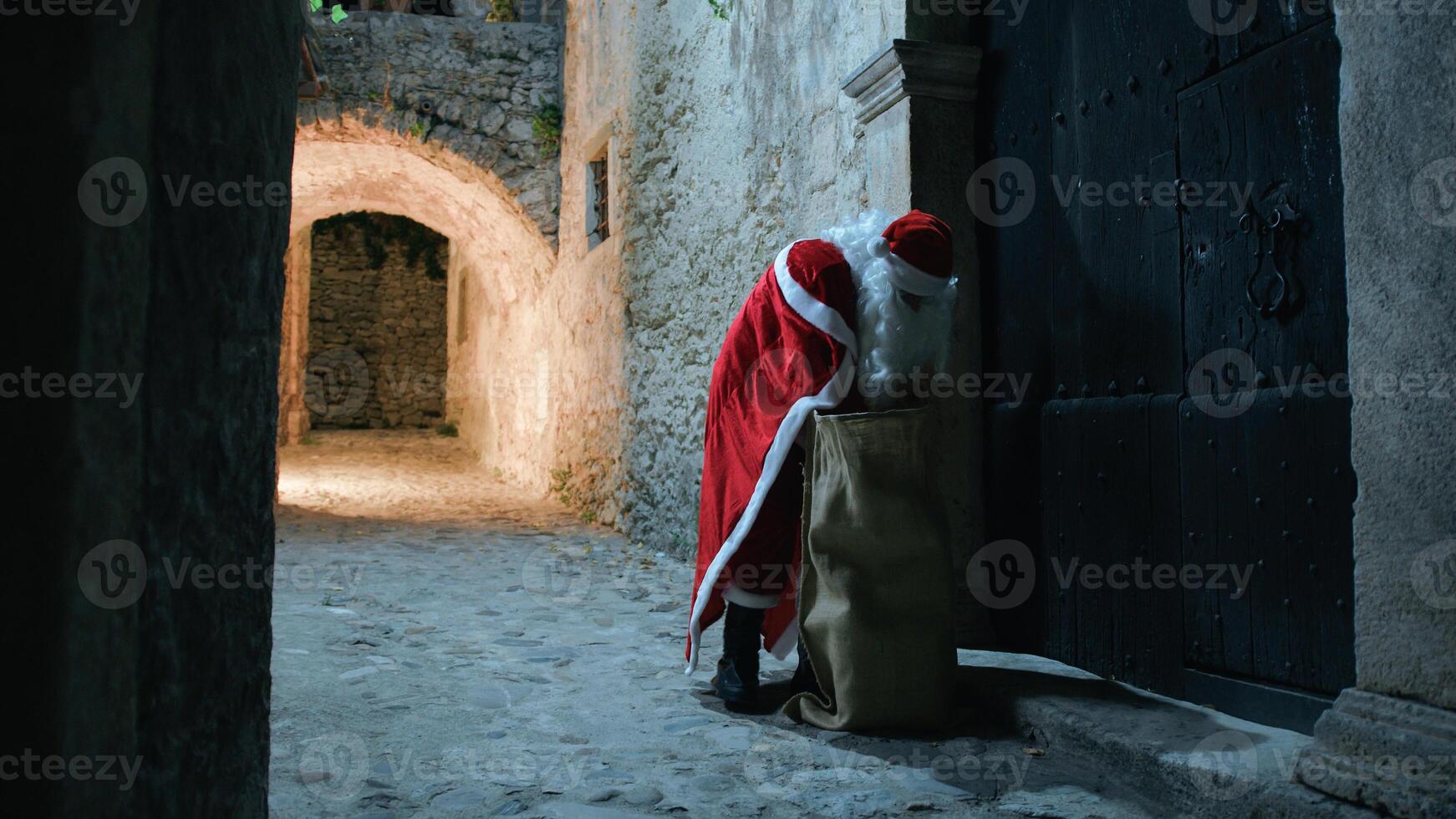 Santa Claus searching for present to deliver photo