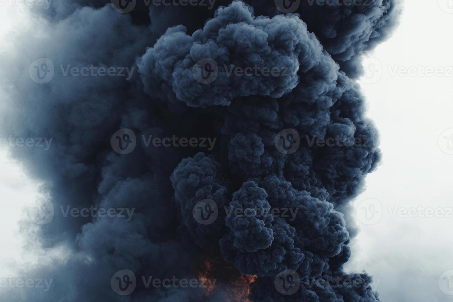 A dramatic eruption of thick black smoke ascends against a bright white background, forming dark clouds that transition into gentle, swirling trails, evoking a sense of movement and energy photo