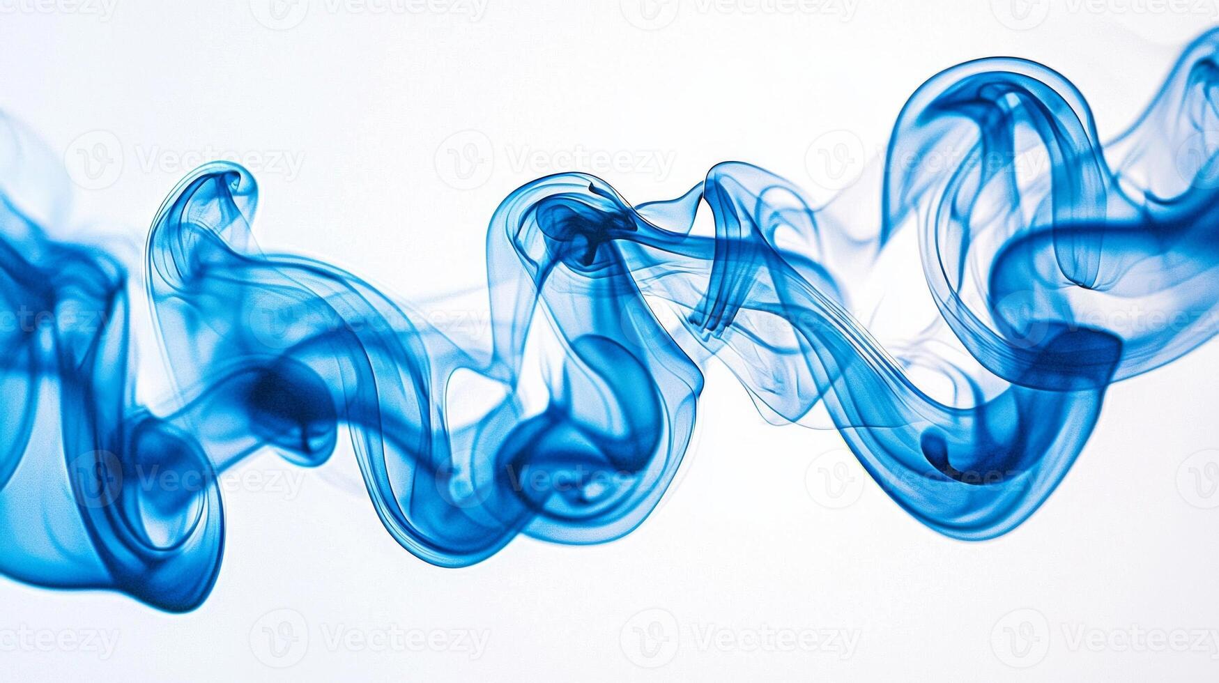 Delicate blue smoke tendrils rise gently, swirling and fading gracefully into lighter shades, evoking a sense of calm and tranquility in their fluid motion. photo