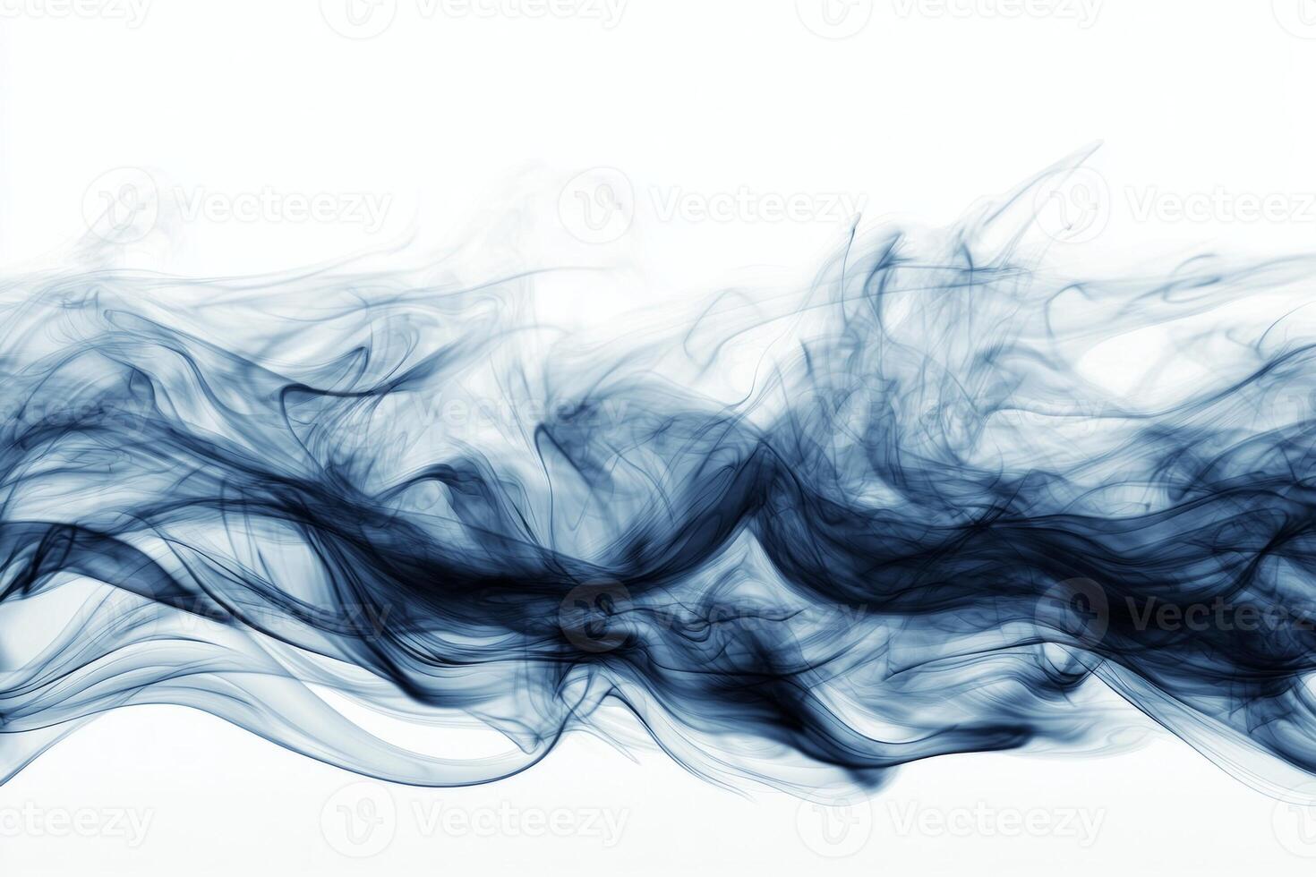 Thick blue smoke swirls beautifully, rising in soft curls on a bright white backdrop. The dark blue hues and expanding edges evoke a sense of depth and mystery. photo