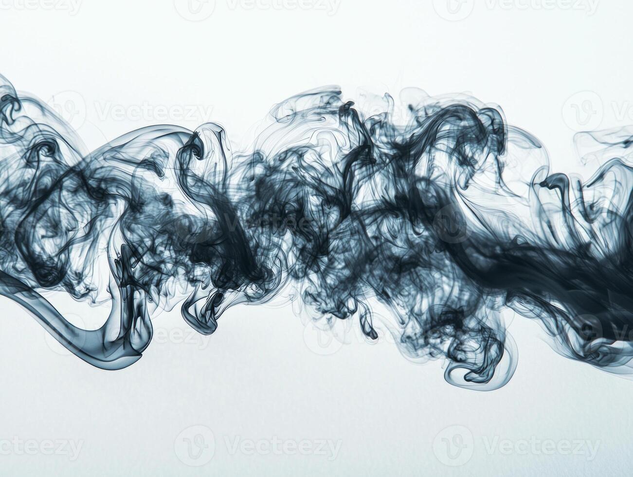 Dynamic tendrils of gray smoke rise gracefully, weaving through the air in intricate patterns against a stark white background, evoking a sense of tranquility and fluidity. photo