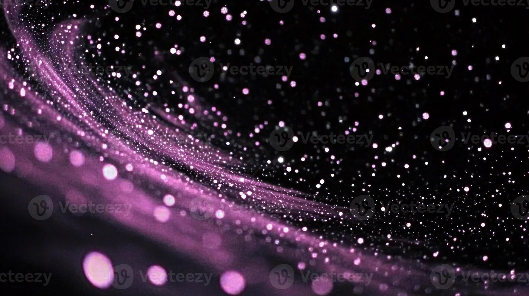Scattered pink dots gracefully form a swirling spiral against a stark black background, creating a soft, glowing effect that captivates the senses and ignites the imagination. photo
