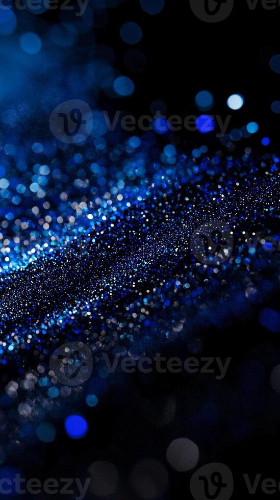 In a stunning display of cosmic beauty, ethereal blue particles radiate outward, creating a shimmering wave of light on a deep black background, captivating the viewer with its vibrant energy. photo