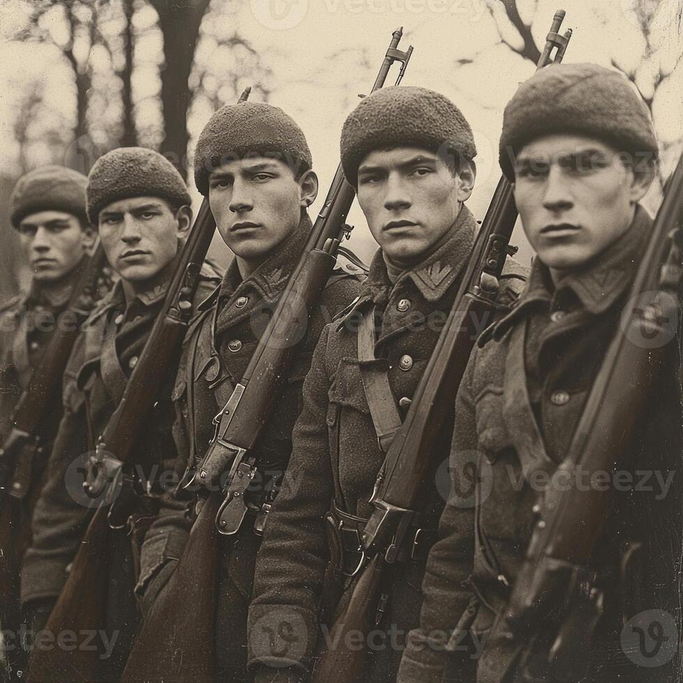 group of five soldiers stands in formation each holding a rifle showcasing their uniforms and serious expressions amid a wooded backdrop during World War I. photo