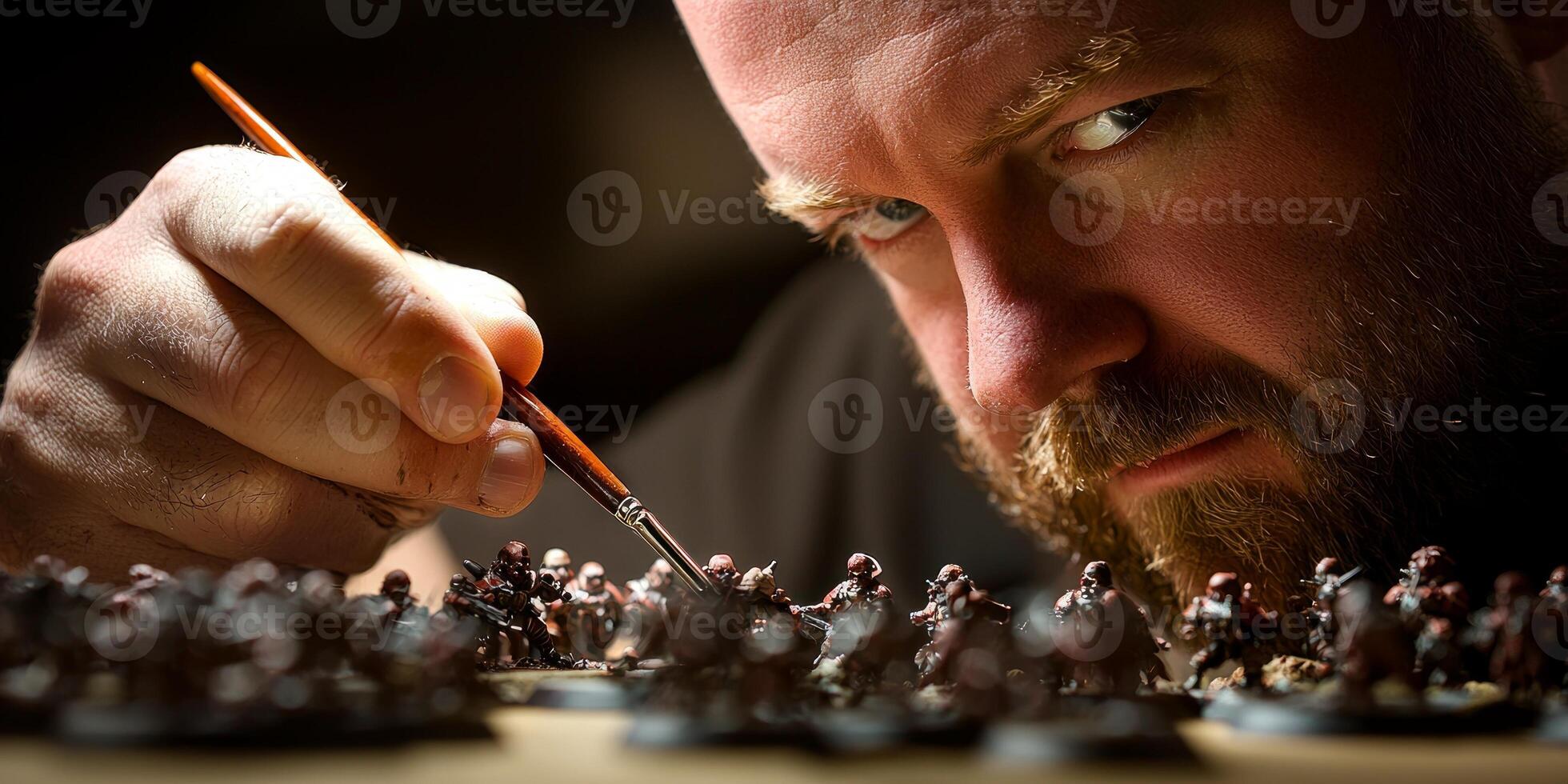 individual is deeply concentrated on painting detailed miniature models at a desk illuminated by a focused lamp showcasing artistic skill and dedication. photo