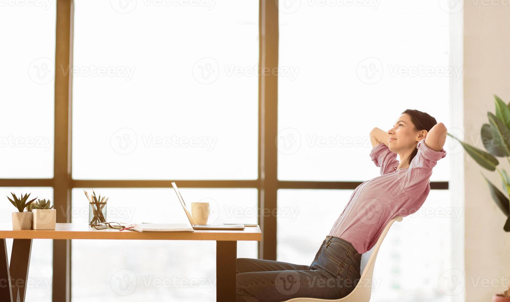 Relax At Office. Side view of calm girl manager leaning back in chair at work, panorama, copyspace, flare light photo