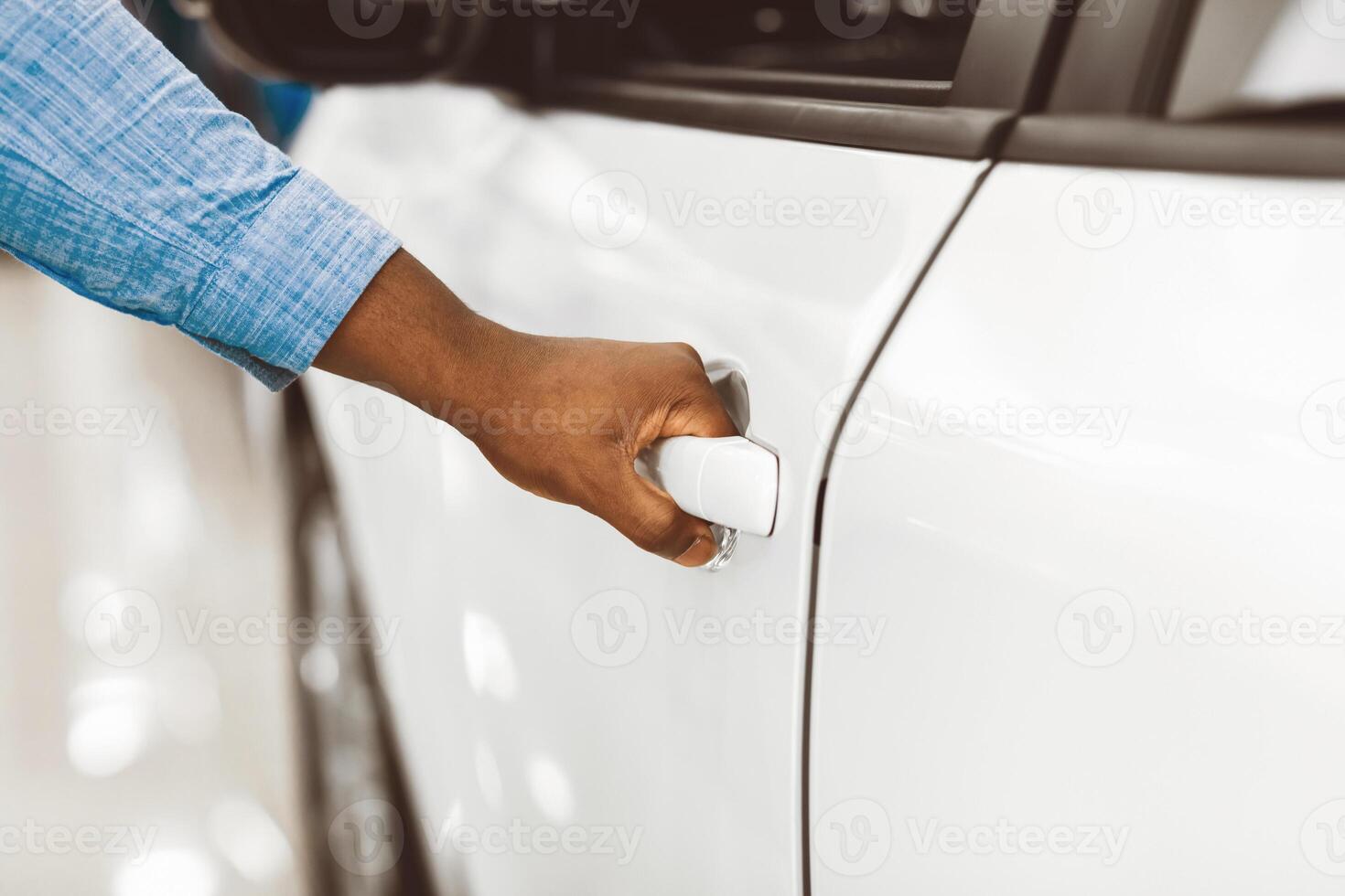 Car Owner. Male Hand Opening New Automobile Door, Unrecognizable Afro Man Buying Auto In Dealership Center. Closeup, Cropped photo