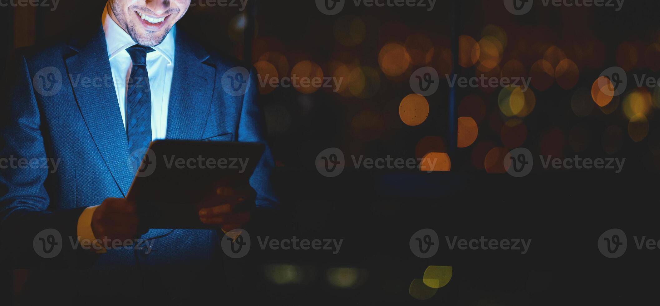 Unrecognizable Businessman Using Digital Tablet And Smiling Reading Business News Online Standing In Modern Office. Panorama, Cropped, Free Space photo