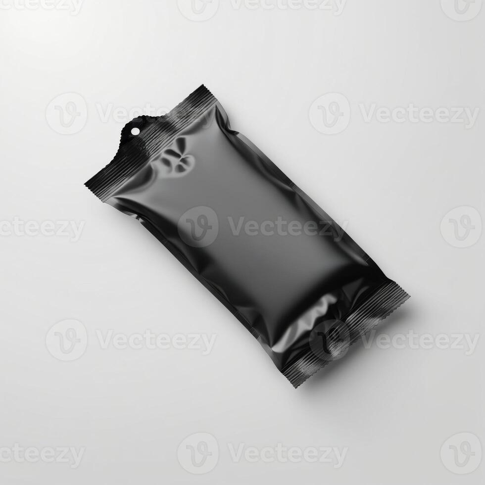 Blank black sachet package isolated on white. Small packaging sachet mockup. photo