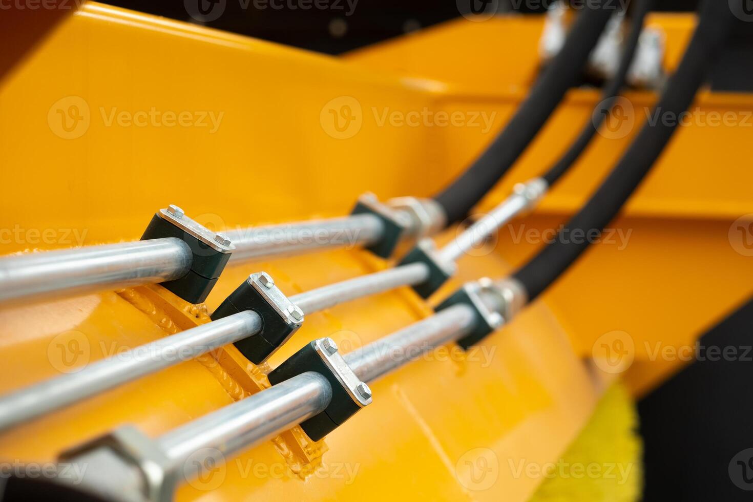 Close-up of an assembly with hydraulic pipes and couplings on a truck photo