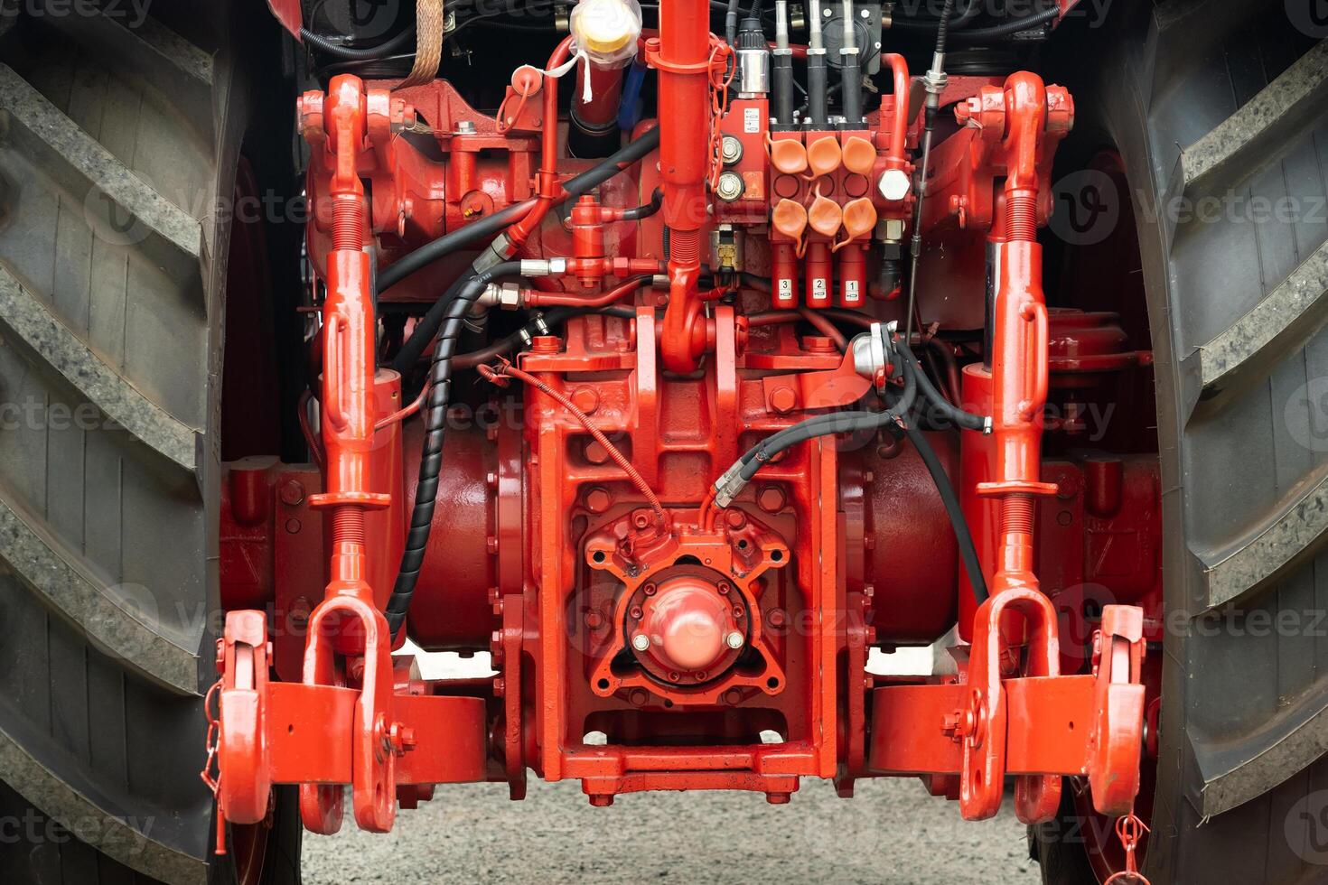 Close-up of part of the new red tractor. Vehicle assembly photo