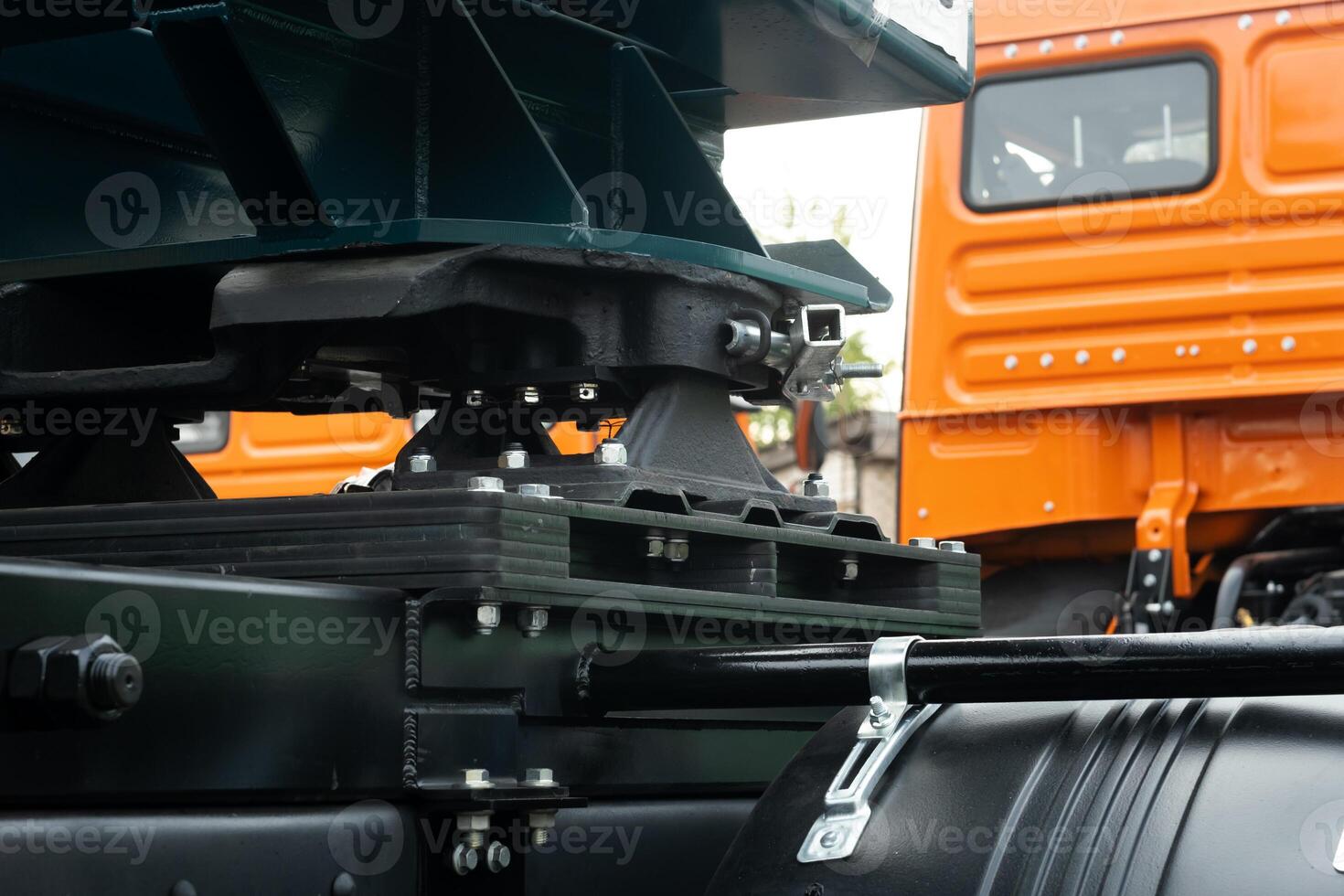 The truck is equipped with a fifth wheel with a special trailer attached to it photo