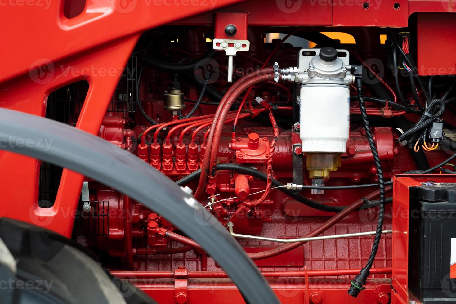 Close-up of part of the new red tractor. Vehicle assembly photo