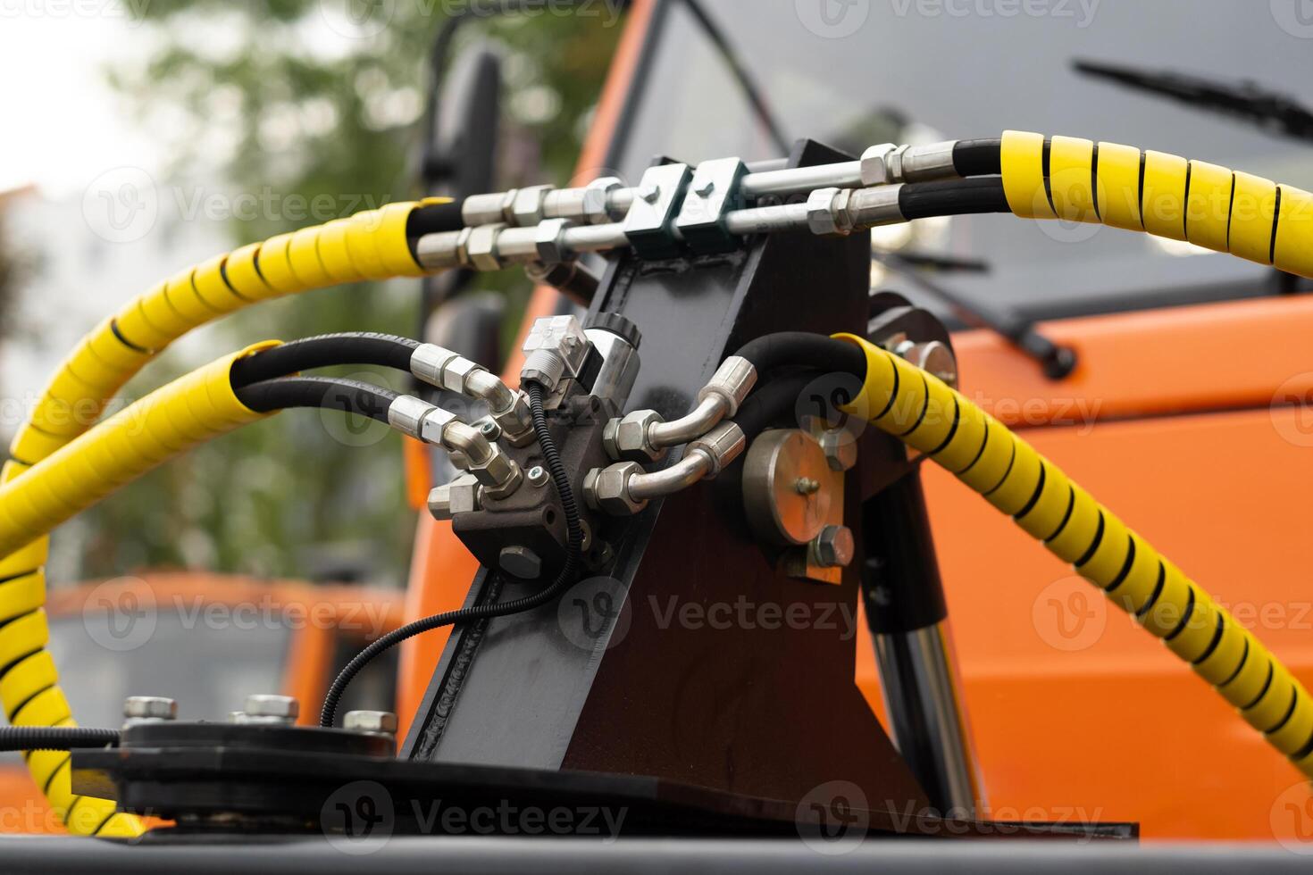 Close-up of an assembly with hydraulic pipes and couplings on a truck photo