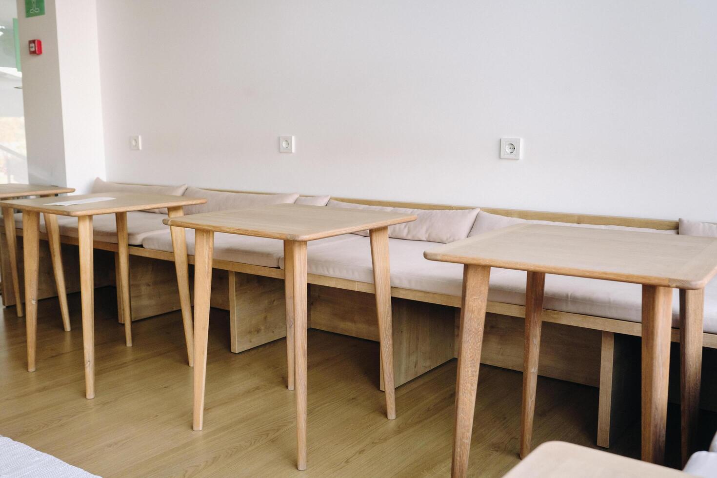 Tables standing in the interior. Places to sit in a cafe photo