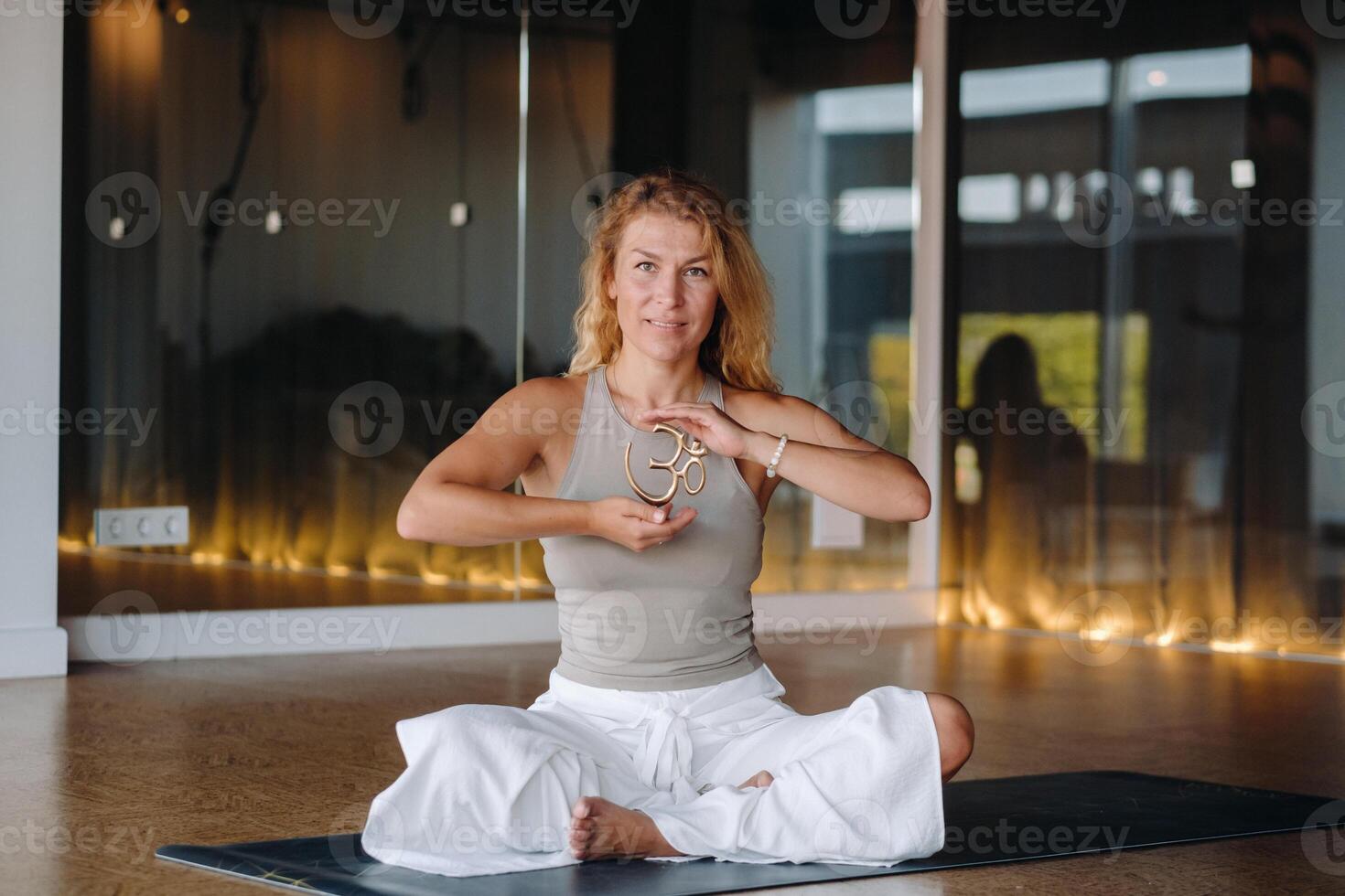 The girl does yoga and is in a state of meditation. The concept of a healthy lifestyle photo