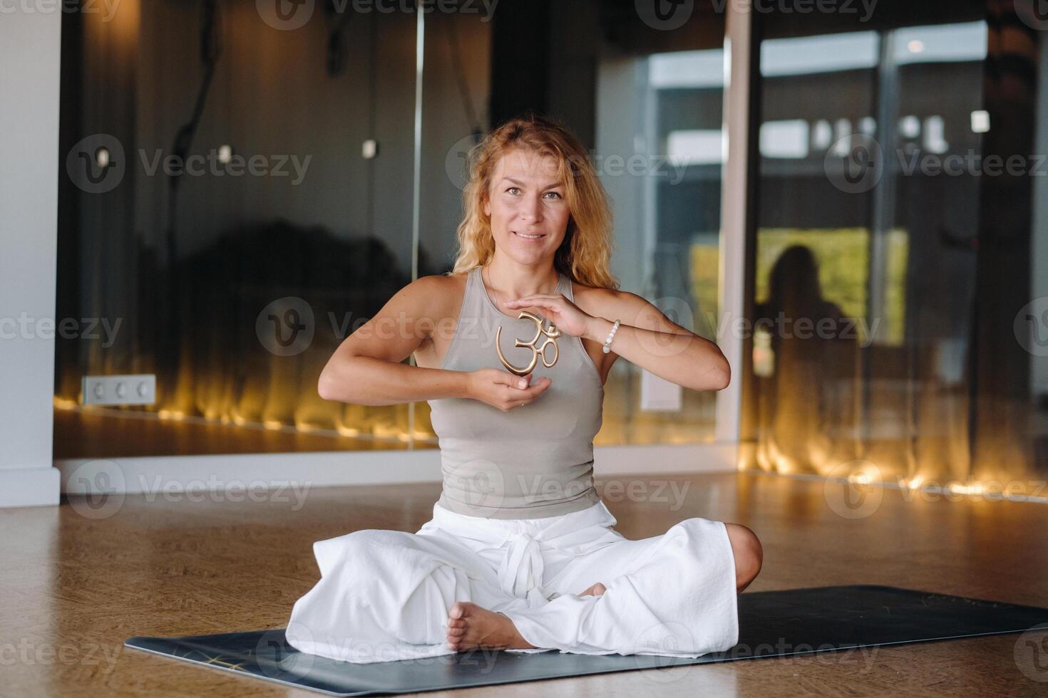 The girl does yoga and is in a state of meditation. The concept of a healthy lifestyle photo