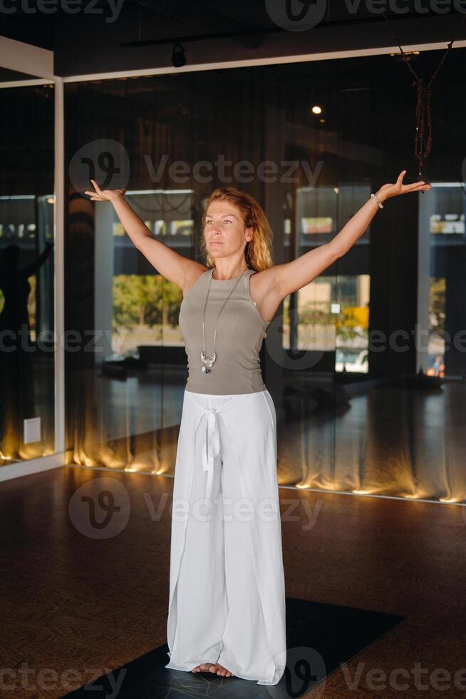 The girl does yoga and is in a state of meditation. The concept of a healthy lifestyle photo
