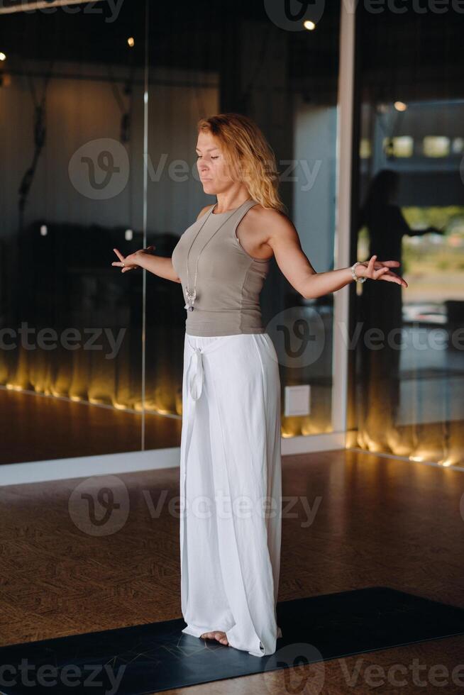 The girl does yoga and is in a state of meditation. The concept of a healthy lifestyle photo
