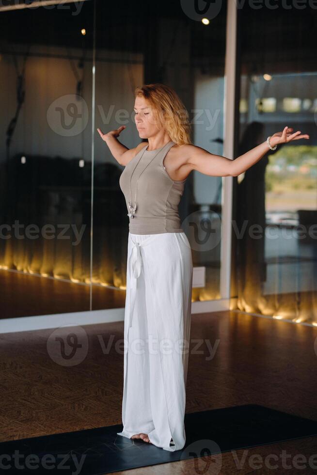 The girl does yoga and is in a state of meditation. The concept of a healthy lifestyle photo