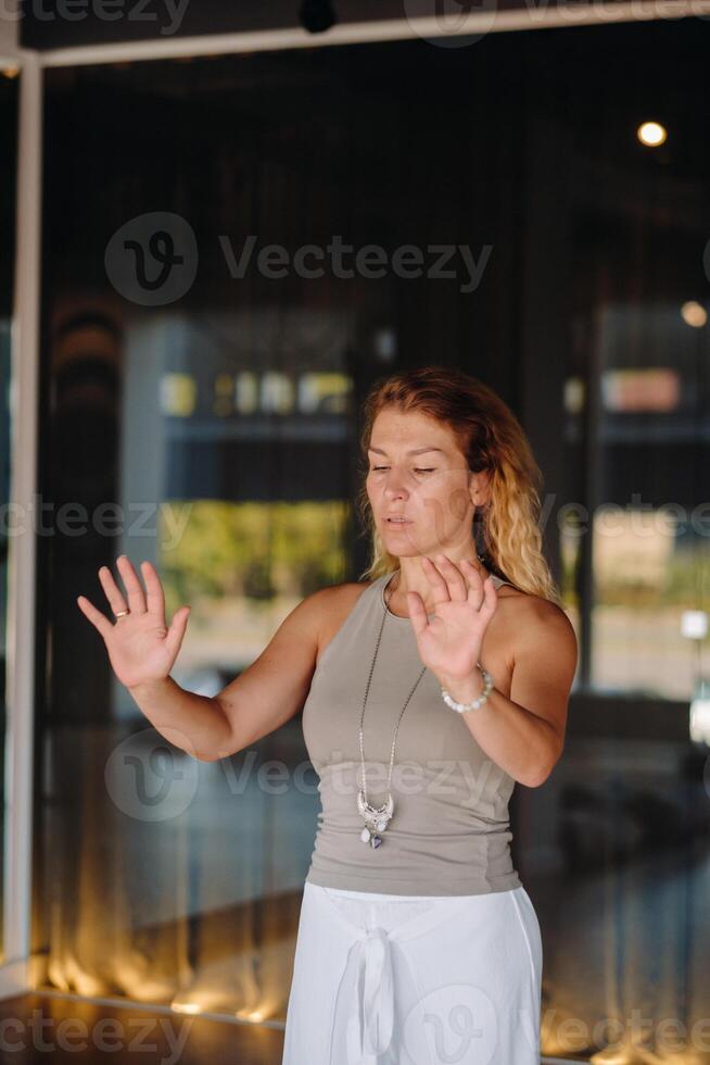 The girl does yoga and is in a state of meditation. The concept of a healthy lifestyle photo