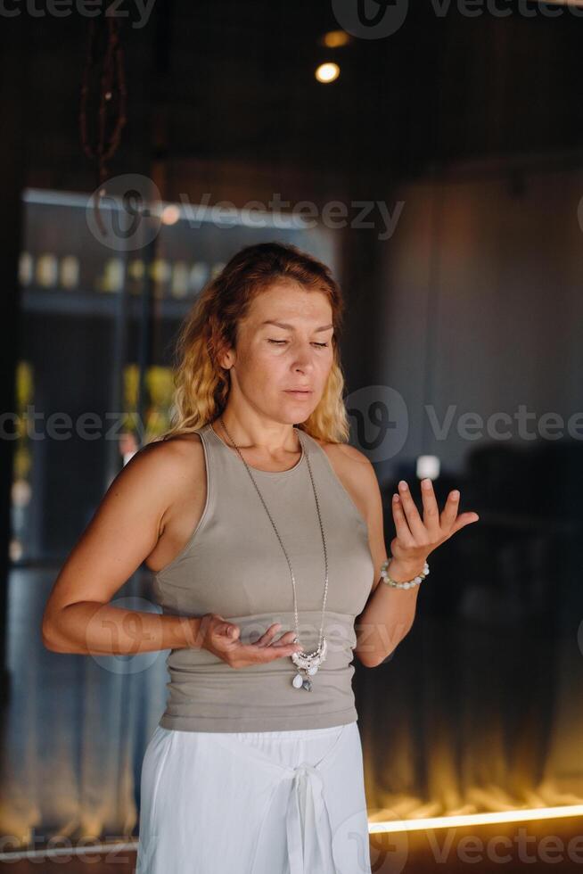 The girl does yoga and is in a state of meditation. The concept of a healthy lifestyle photo
