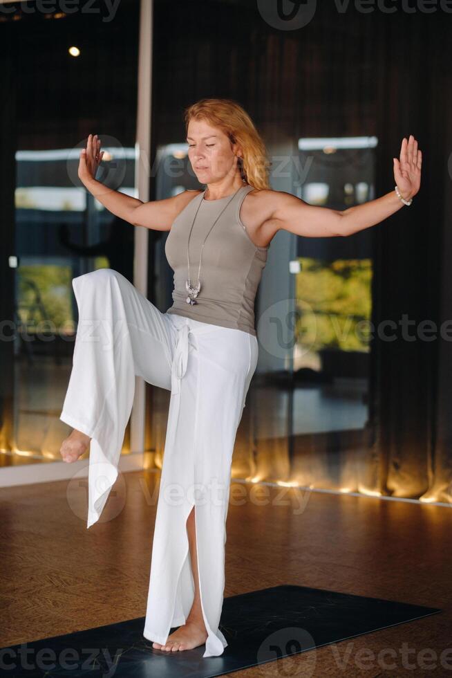 The girl does yoga and is in a state of meditation. The concept of a healthy lifestyle photo