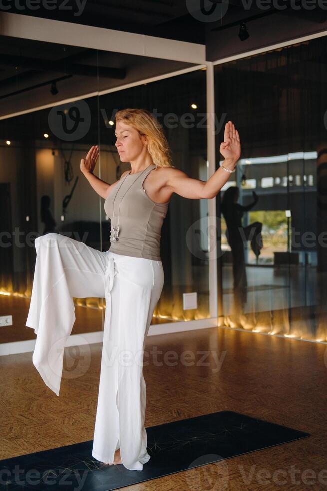 The girl does yoga and is in a state of meditation. The concept of a healthy lifestyle photo