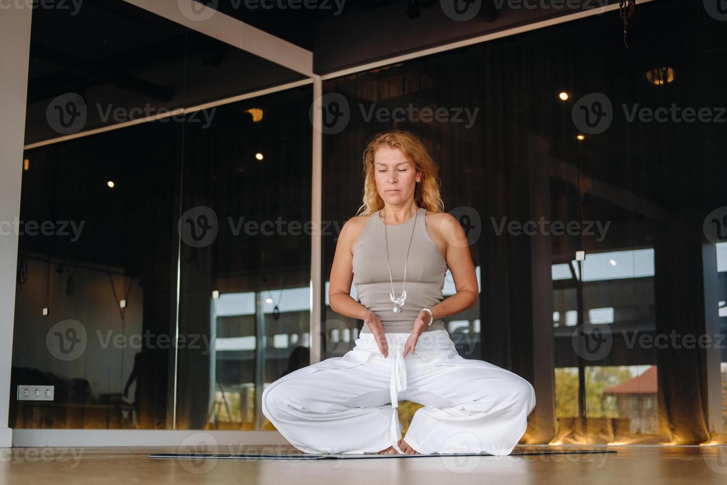 The girl does yoga and is in a state of meditation. The concept of a healthy lifestyle photo