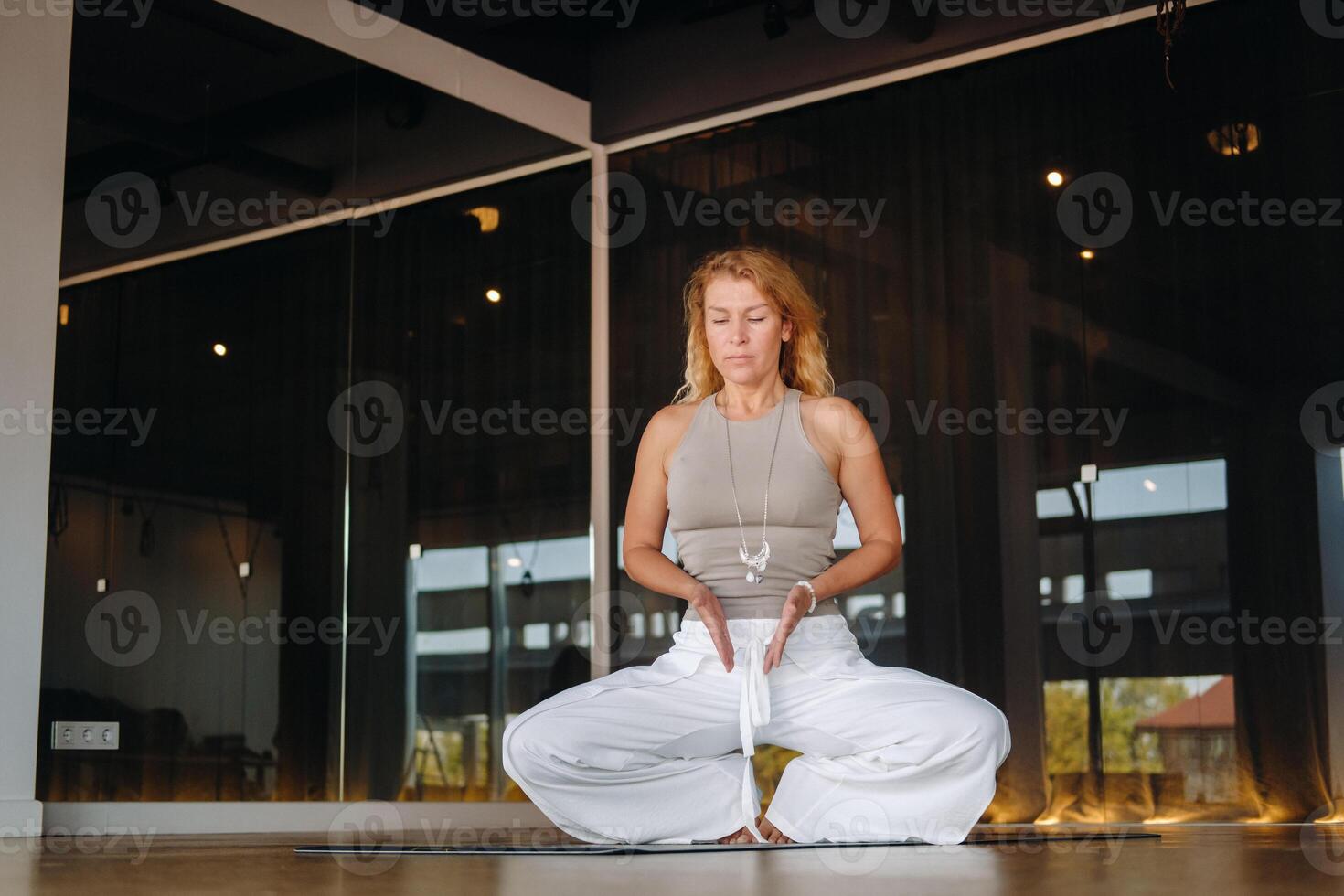 The girl does yoga and is in a state of meditation. The concept of a healthy lifestyle photo