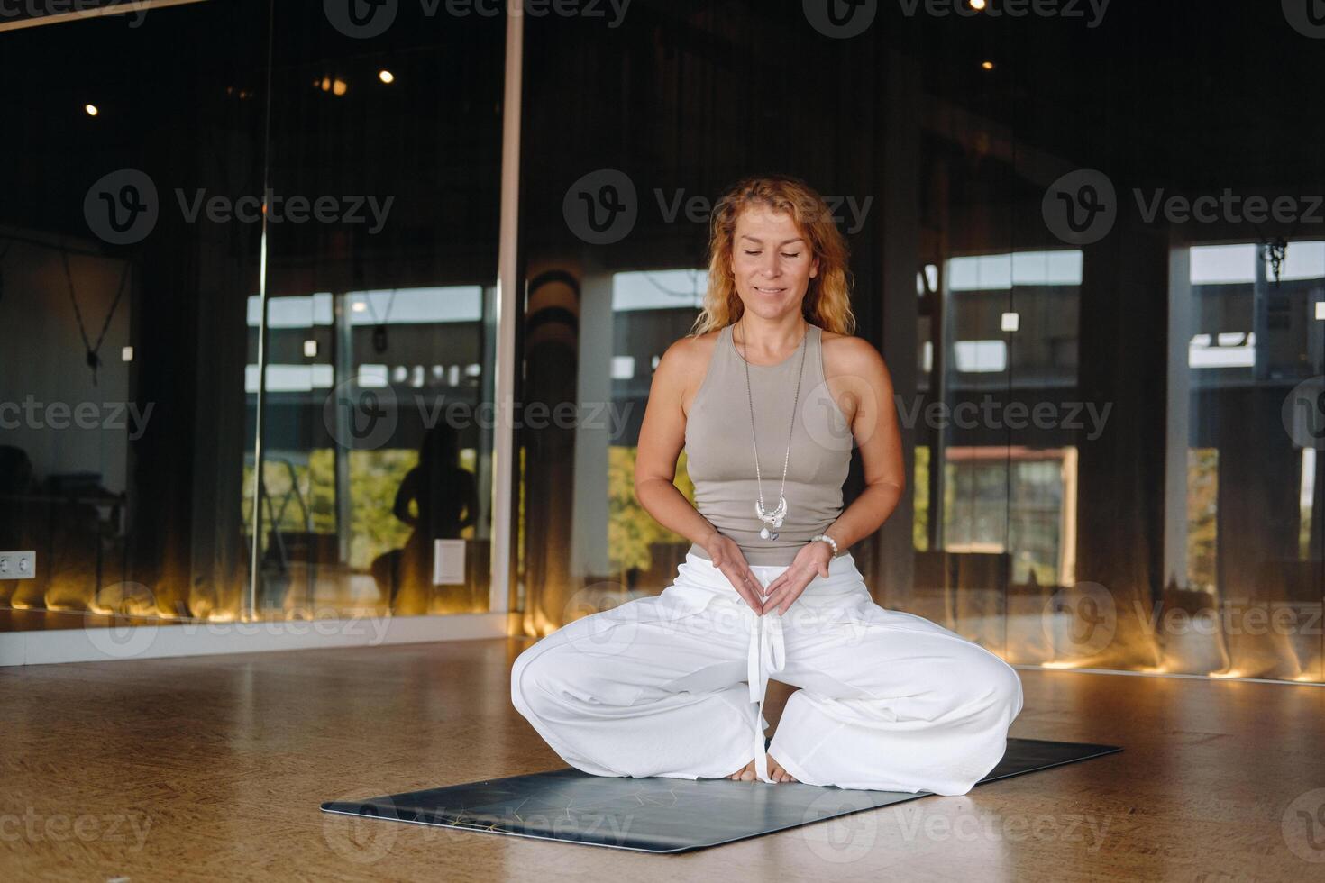 The girl does yoga and is in a state of meditation. The concept of a healthy lifestyle photo
