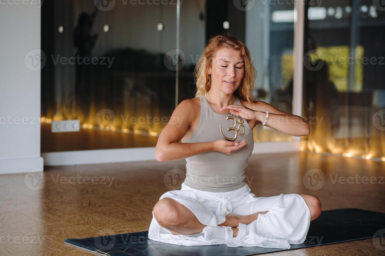 The girl does yoga and is in a state of meditation. The concept of a healthy lifestyle photo