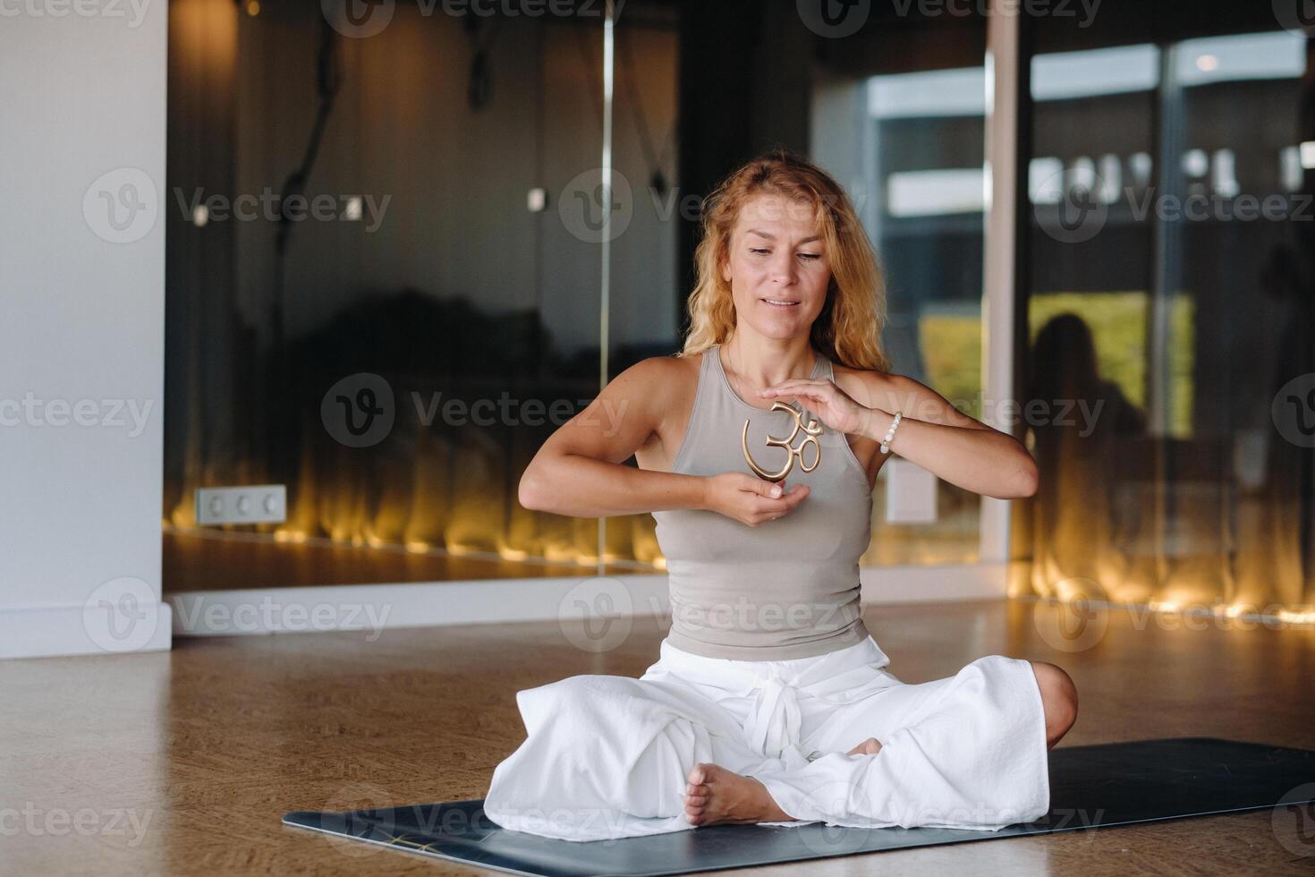 The girl does yoga and is in a state of meditation. The concept of a healthy lifestyle photo