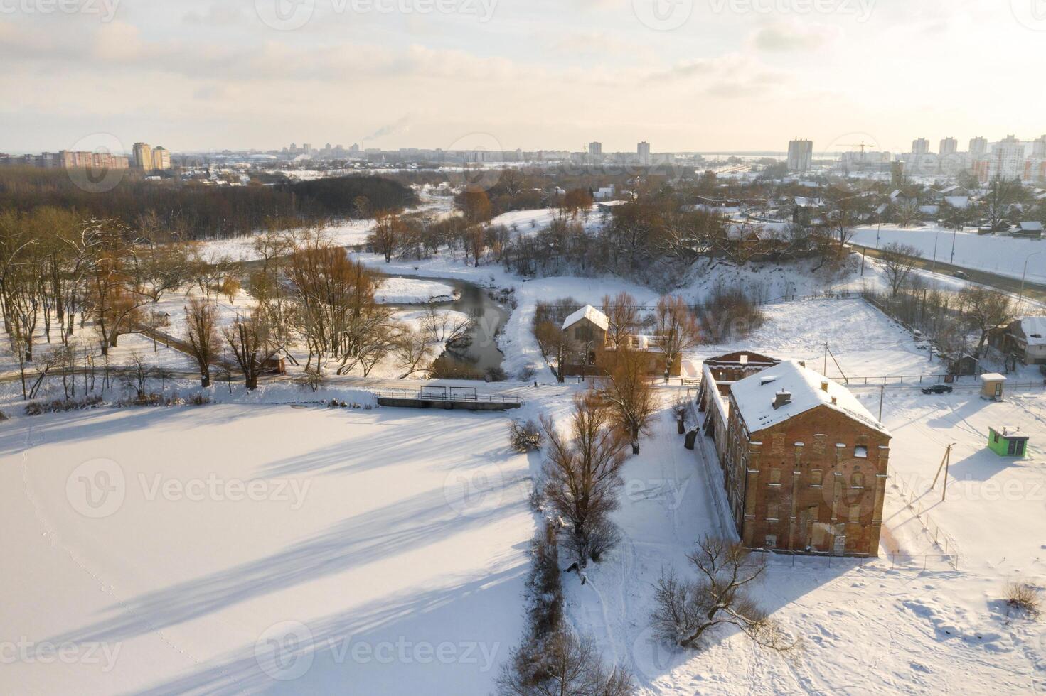 Abandoned old buildings in the Winter Loshitsky Park. Minsk, Belarus photo